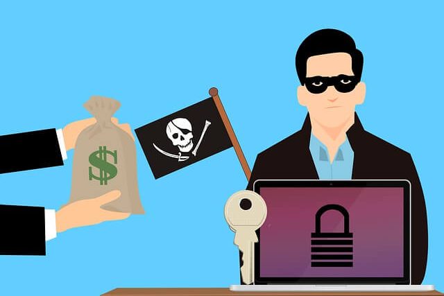 ransomware - ilustração de um ladrão branco, com máscara nos olhos, atrás de um computador com uma imagem de um cadeado fechado, recebendo um saco de dinheiro